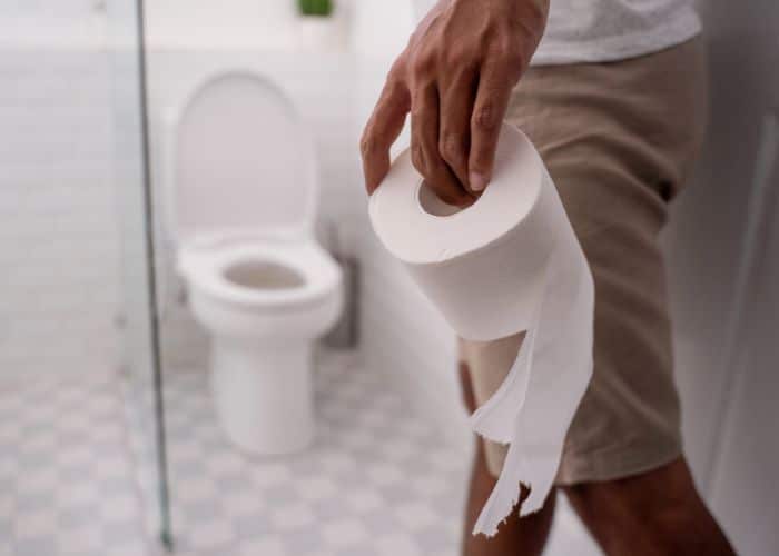 holding toilet paper