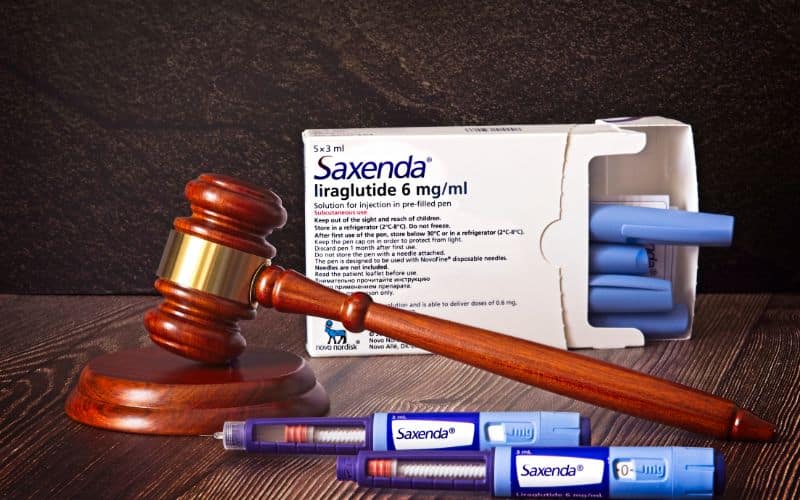 Saxenda Injection pens on a wooden background Injections for weight loss