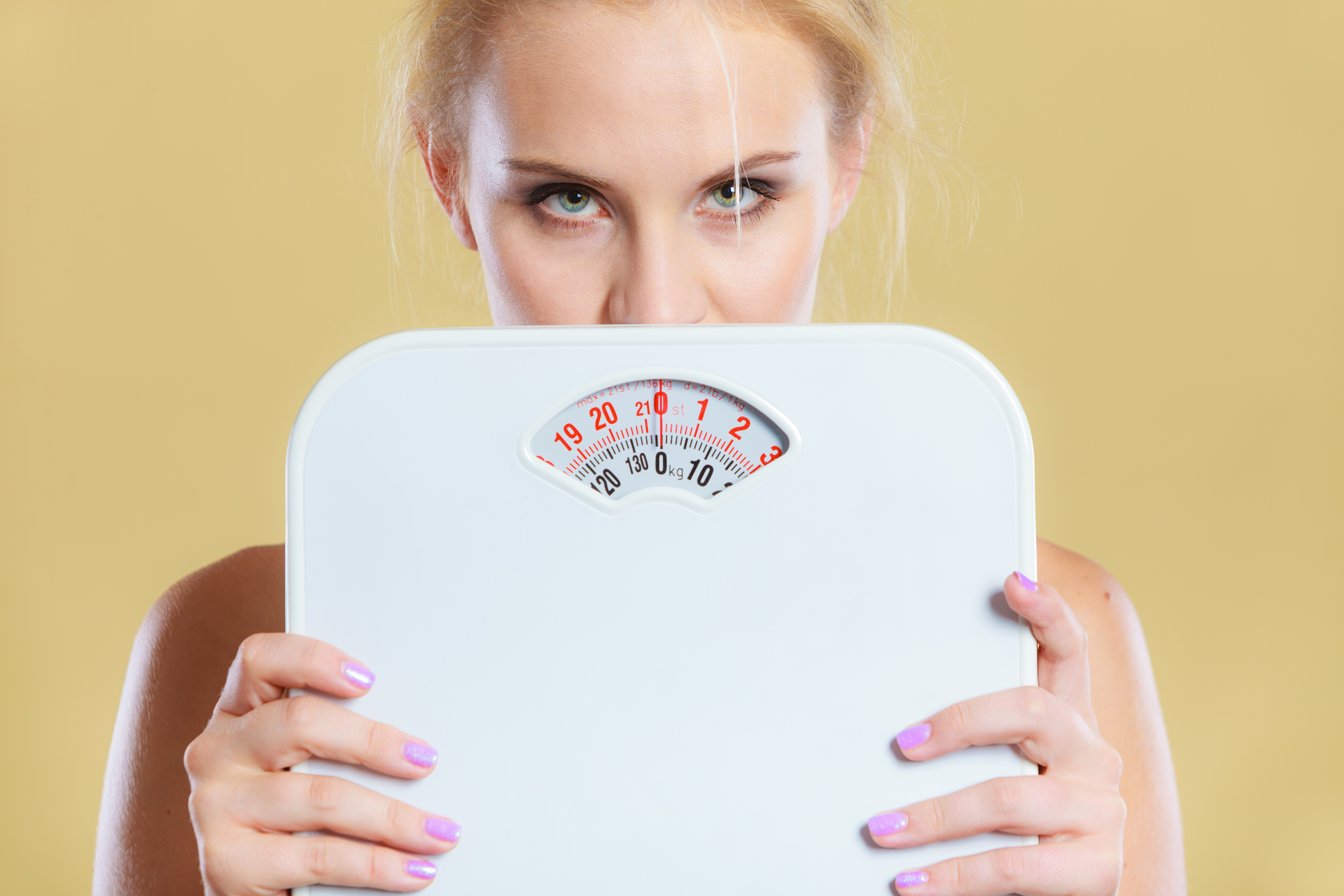 Frustrated woman unhappy with weight gain
