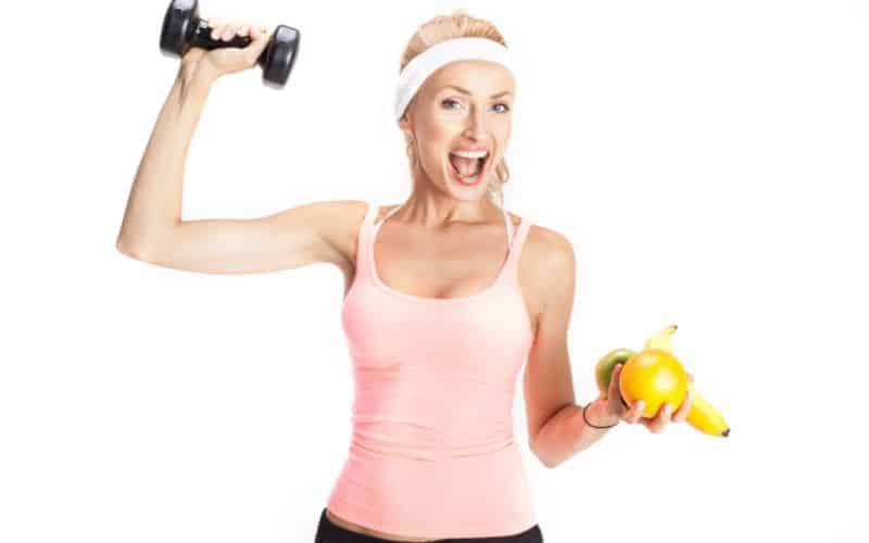 blonde girl with fruits for her diet and exercise