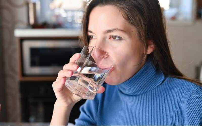 woman drinking plenty of water