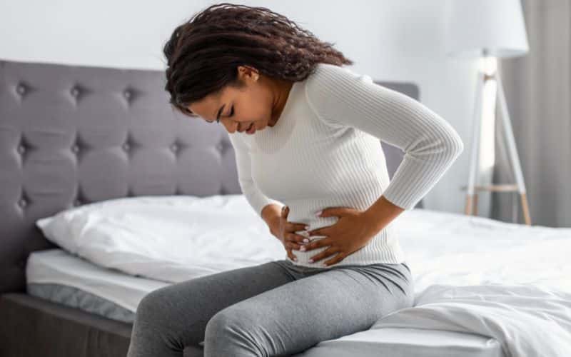 woman experiencing Gastrointestinal Issues