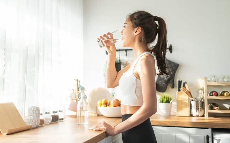 women drinking plenty of water preventing dehydration